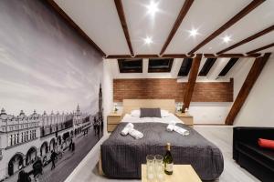 Posteľ alebo postele v izbe v ubytovaní Cracow Rent Apartments