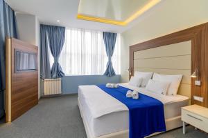 Katil atau katil-katil dalam bilik di Privilege Suites by Central Park