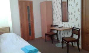 Postel nebo postele na pokoji v ubytování Viesu māja Ezerkalns