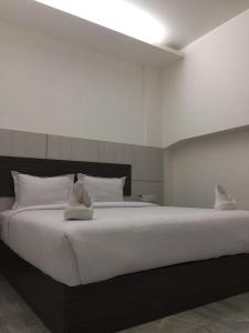 Tempat tidur dalam kamar di Seventeen Hotel