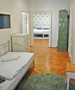 Säng eller sängar i ett rum på Villa Winter Prestige Apartments