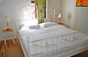Een bed of bedden in een kamer bij Villa Winter Prestige Apartments