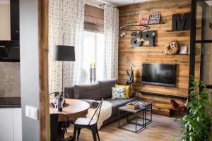 Televízia a/alebo spoločenská miestnosť v ubytovaní Nice Stay 2