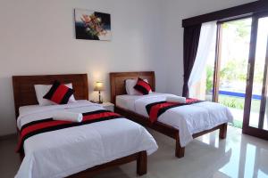 Una cama o camas en una habitación de Bagong Guest House