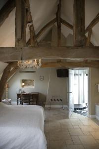 Postel nebo postele na pokoji v ubytování Auberge 's Gravenhof