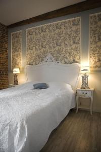 Postel nebo postele na pokoji v ubytování Auberge 's Gravenhof