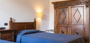 Postel nebo postele na pokoji v ubytování Hotel Titano