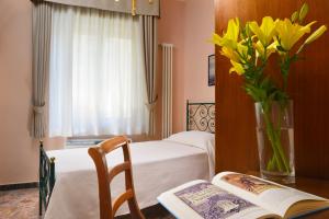 Postel nebo postele na pokoji v ubytování Hotel Titano