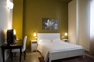 Postel nebo postele na pokoji v ubytování B&B Suite Paciotti