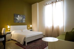 Postel nebo postele na pokoji v ubytování B&B Suite Paciotti