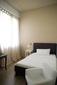 Postel nebo postele na pokoji v ubytování B&B Suite Paciotti