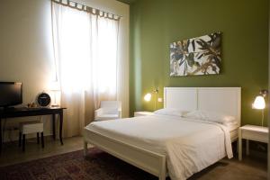 Postel nebo postele na pokoji v ubytování B&B Suite Paciotti