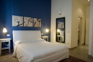 Postel nebo postele na pokoji v ubytování B&B Suite Paciotti