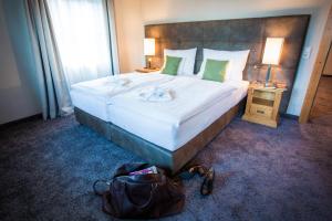 A bed or beds in a room at Hotel Annelies