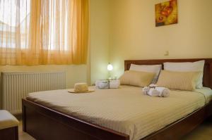 Postel nebo postele na pokoji v ubytování Olivera Apartments