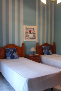 Ένα ή περισσότερα κρεβάτια σε δωμάτιο στο Casa Gusber I