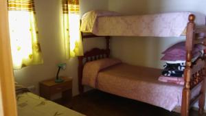 Postel nebo postele na pokoji v ubytování Cabañas Casa de colores