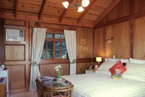 Ένα ή περισσότερα κρεβάτια σε δωμάτιο στο Tamborine Mountain Bed and Breakfast
