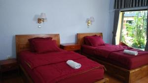 Postel nebo postele na pokoji v ubytování The Arya guest house