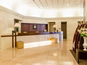 a lobby with a reception desk in a building at Ginza Creston in Tokyo