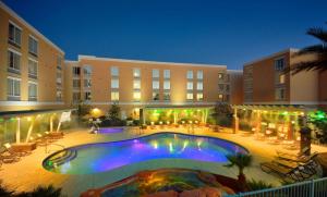 a large swimming pool in a large building at Hyatt Place Phoenix/ Mesa in Mesa