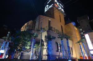 a building with a neon sign on top of it at HOTEL PERRIER (Adult Only) in Tokyo