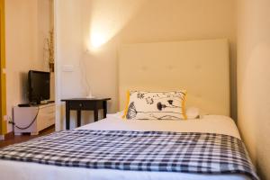 Postel nebo postele na pokoji v ubytování Hotel Titano