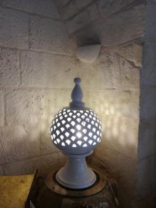 a blue and white vase sitting on a table at Masseria Asciano in Ostuni