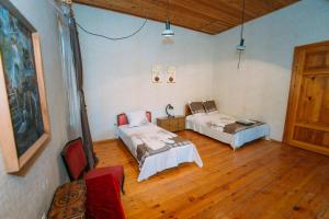 Postel nebo postele na pokoji v ubytování Bolnisi Prime House