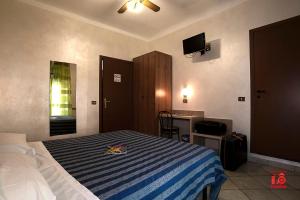 Postel nebo postele na pokoji v ubytování Hotel Bel Sit
