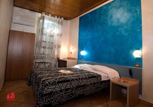 Postel nebo postele na pokoji v ubytování Hotel Bel Sit