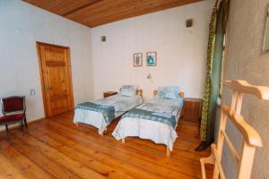 Postel nebo postele na pokoji v ubytování Bolnisi Prime House