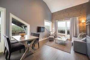 TV a/nebo společenská místnost v ubytování Highland Lodge