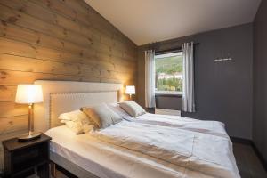 Postel nebo postele na pokoji v ubytování Highland Lodge