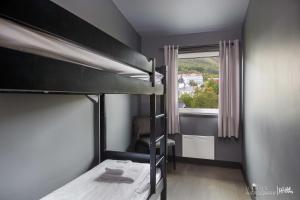 Postel nebo postele na pokoji v ubytování Highland Lodge + 30 fotografií