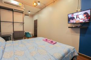 Un pat sau paturi într-o cameră la Baan Bang Saray Boutique3