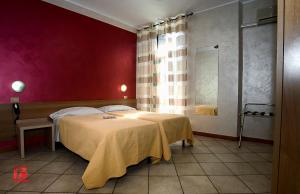 Postel nebo postele na pokoji v ubytování Hotel Bel Sit