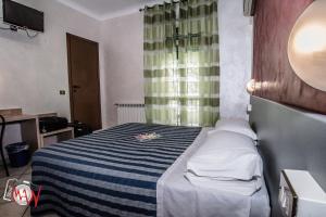 Postel nebo postele na pokoji v ubytování Hotel Bel Sit