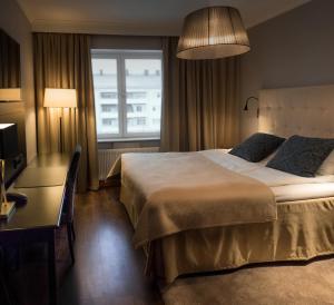 Postel nebo postele na pokoji v ubytování Home Hotel Smedjan