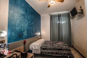 Postel nebo postele na pokoji v ubytování Hotel Bel Sit
