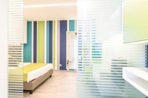 Postel nebo postele na pokoji v ubytování Hotel Tenda Rossa
