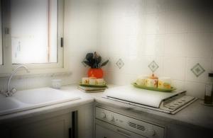 a kitchen counter with two plates of food on it at Casa Vacanze Zia Titina in Trabia