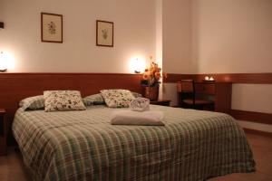 Postel nebo postele na pokoji v ubytování Albergo Bucaneve