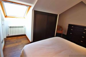 Postel nebo postele na pokoji v ubytování Casa Estrella de Garda