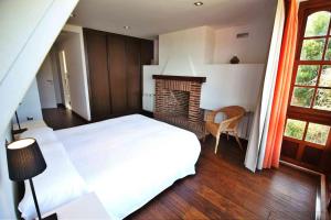 Postel nebo postele na pokoji v ubytování Casa Estrella de Garda