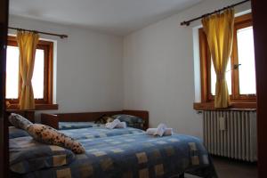 Voodi või voodid majutusasutuse Albergo Bucaneve toas