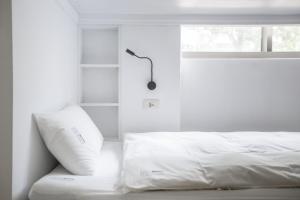 Letto o letti in una camera di We Come Hostel