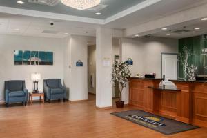 The lobby or reception area at Days Inn by Wyndham Evans Mills/Fort Drum
