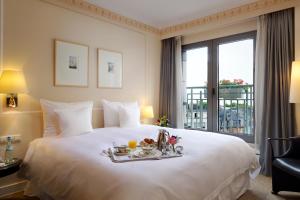 Ένα ή περισσότερα κρεβάτια σε δωμάτιο στο Hotel Parc Belair