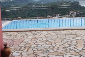 a large swimming pool on top of a building at Villa Eora in Keri